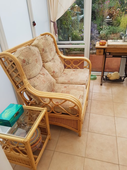 Tired and faded conservatory chair